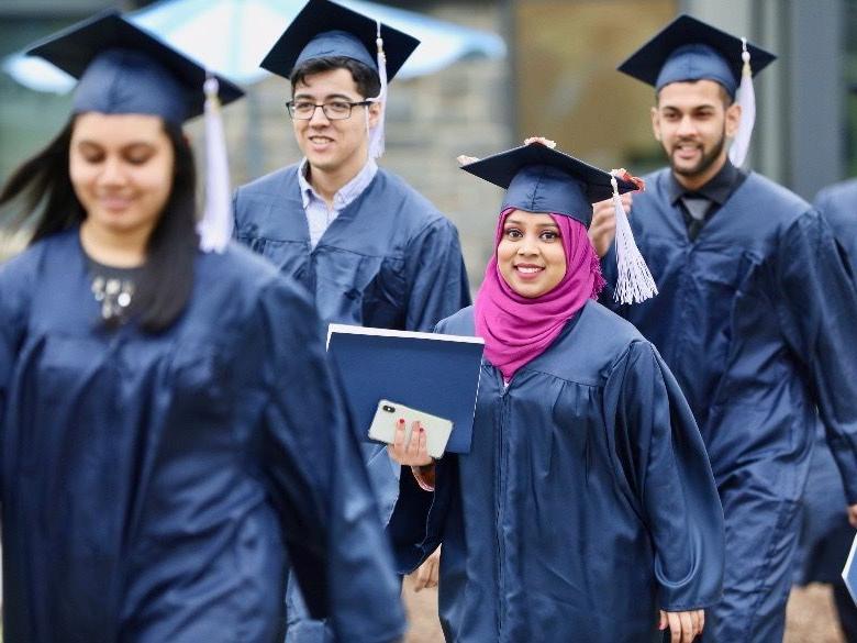 Students walking to Commencement ceremony